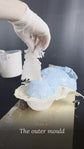 Building the outer mould: resin soaked matting laid over the silicone glove